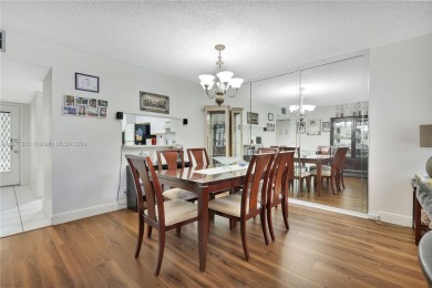 Enjoy beautiful golf course views from the large screened porch on Flamingo Lakes Country Club in Florida - for sale on GolfHomes.com, golf home, golf lot
