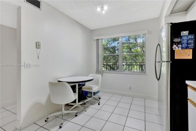 Enjoy beautiful golf course views from the large screened porch on Flamingo Lakes Country Club in Florida - for sale on GolfHomes.com, golf home, golf lot