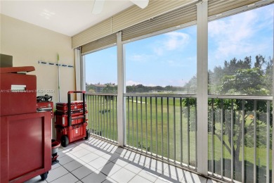 Enjoy beautiful golf course views from the large screened porch on Flamingo Lakes Country Club in Florida - for sale on GolfHomes.com, golf home, golf lot