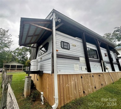 This property includes double lots that back up to one another on The Tillery Tradition Country Club in North Carolina - for sale on GolfHomes.com, golf home, golf lot