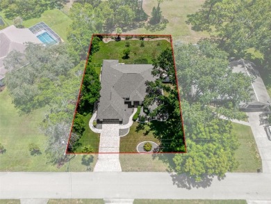 This meticulously maintained, gorgeous Alexander Custom-Built on Oak Hills Country Club in Florida - for sale on GolfHomes.com, golf home, golf lot