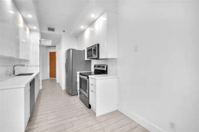 Stunning remodeled unit with golf views! Experience modern on Turnberry Isle Resort and Club in Florida - for sale on GolfHomes.com, golf home, golf lot