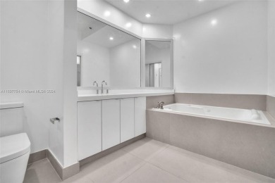 Stunning remodeled unit with golf views! Experience modern on Turnberry Isle Resort and Club in Florida - for sale on GolfHomes.com, golf home, golf lot