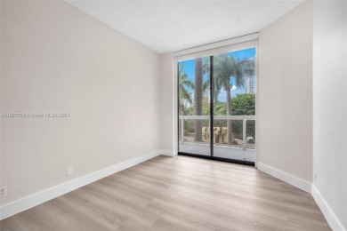 Stunning remodeled unit with golf views! Experience modern on Turnberry Isle Resort and Club in Florida - for sale on GolfHomes.com, golf home, golf lot