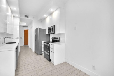 Stunning remodeled unit with golf views! Experience modern on Turnberry Isle Resort and Club in Florida - for sale on GolfHomes.com, golf home, golf lot