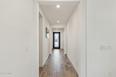 The Carlyle's inviting covered porch and entry flow into the on Sterling Grove Golf & Country Club in Arizona - for sale on GolfHomes.com, golf home, golf lot