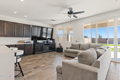 The Carlyle's inviting covered porch and entry flow into the on Sterling Grove Golf & Country Club in Arizona - for sale on GolfHomes.com, golf home, golf lot