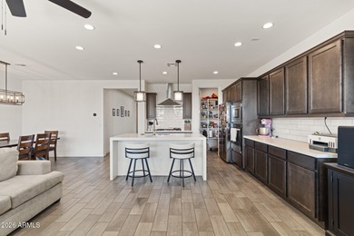 The Carlyle's inviting covered porch and entry flow into the on Sterling Grove Golf & Country Club in Arizona - for sale on GolfHomes.com, golf home, golf lot