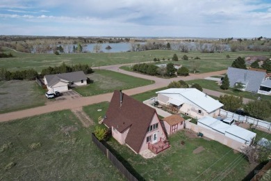 NEW ROOF! NEW CEDAR SIDING and a perfect location! Lake Beckwith on Hollydot Golf Course in Colorado - for sale on GolfHomes.com, golf home, golf lot