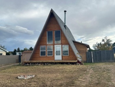 NEW ROOF! NEW CEDAR SIDING and a perfect location! Lake Beckwith on Hollydot Golf Course in Colorado - for sale on GolfHomes.com, golf home, golf lot