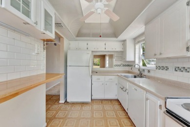 Enjoy peaceful living in this charming 2-bedroom, 2-bathroom on Inverrary Country Club in Florida - for sale on GolfHomes.com, golf home, golf lot