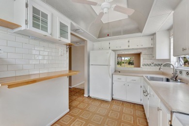 Enjoy peaceful living in this charming 2-bedroom, 2-bathroom on Inverrary Country Club in Florida - for sale on GolfHomes.com, golf home, golf lot