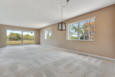 Enjoy peaceful living in this charming 2-bedroom, 2-bathroom on Inverrary Country Club in Florida - for sale on GolfHomes.com, golf home, golf lot