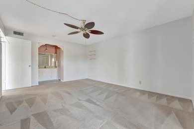 Enjoy peaceful living in this charming 2-bedroom, 2-bathroom on Inverrary Country Club in Florida - for sale on GolfHomes.com, golf home, golf lot
