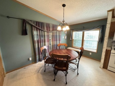 Welcome to this well-maintained 3-bedroom, 2-bath manufactured on Crystal View Municipal Golf Course in Michigan - for sale on GolfHomes.com, golf home, golf lot