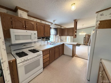 Welcome to this well-maintained 3-bedroom, 2-bath manufactured on Crystal View Municipal Golf Course in Michigan - for sale on GolfHomes.com, golf home, golf lot