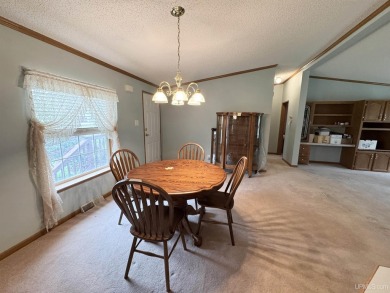 Welcome to this well-maintained 3-bedroom, 2-bath manufactured on Crystal View Municipal Golf Course in Michigan - for sale on GolfHomes.com, golf home, golf lot