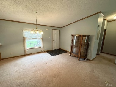 Welcome to this well-maintained 3-bedroom, 2-bath manufactured on Crystal View Municipal Golf Course in Michigan - for sale on GolfHomes.com, golf home, golf lot