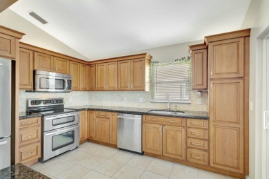 This Newly Updated 3BR/2BA Home Rests in the Highly Desirable on The Golf Club of Jupiter in Florida - for sale on GolfHomes.com, golf home, golf lot