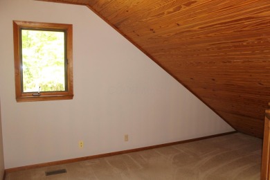 Check out this charming, cozy cabin w/ a fantastic corner lot on Hide-A-Way Hills Golf Club in Ohio - for sale on GolfHomes.com, golf home, golf lot