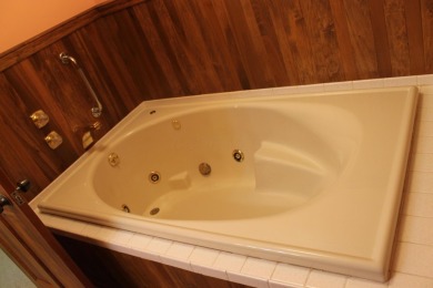 Check out this charming, cozy cabin w/ a fantastic corner lot on Hide-A-Way Hills Golf Club in Ohio - for sale on GolfHomes.com, golf home, golf lot