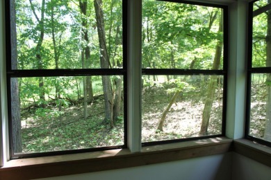 Check out this charming, cozy cabin w/ a fantastic corner lot on Hide-A-Way Hills Golf Club in Ohio - for sale on GolfHomes.com, golf home, golf lot
