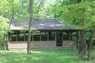 Check out this charming, cozy cabin w/ a fantastic corner lot on Hide-A-Way Hills Golf Club in Ohio - for sale on GolfHomes.com, golf home, golf lot