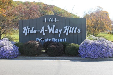 Check out this charming, cozy cabin w/ a fantastic corner lot on Hide-A-Way Hills Golf Club in Ohio - for sale on GolfHomes.com, golf home, golf lot