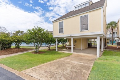 This beautifully updated freestanding three-bedroom beach villa on Sandpiper Cove Golf Course in Florida - for sale on GolfHomes.com, golf home, golf lot