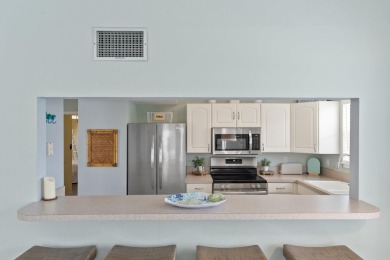 This beautifully updated freestanding three-bedroom beach villa on Sandpiper Cove Golf Course in Florida - for sale on GolfHomes.com, golf home, golf lot