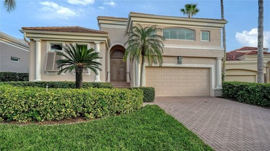 Situated within the gated Queens Harbour enclave of Bay Isles on Longboat Key Golf Club Resort in Florida - for sale on GolfHomes.com, golf home, golf lot