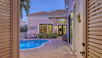 Situated within the gated Queens Harbour enclave of Bay Isles on Longboat Key Golf Club Resort in Florida - for sale on GolfHomes.com, golf home, golf lot