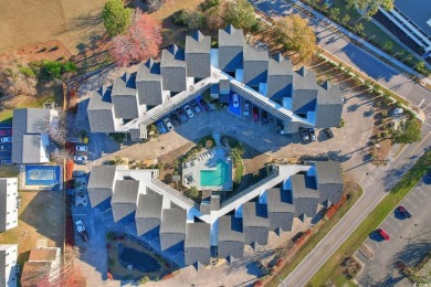 Discover coastal living at its finest in this 2-bedroom on Beachwood Golf Club in South Carolina - for sale on GolfHomes.com, golf home, golf lot