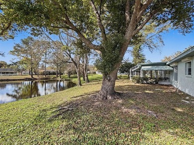 Welcome to this waterfront well-maintained two-bedroom, two-bath on Highland Lakes Executive Golf Course in Florida - for sale on GolfHomes.com, golf home, golf lot