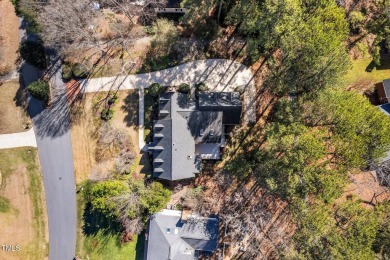 This charming Williamsburg-style custom-built home in the highly on Lochmere Golf Club in North Carolina - for sale on GolfHomes.com, golf home, golf lot