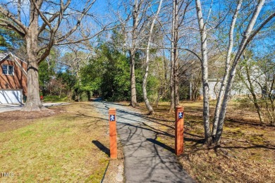 This charming Williamsburg-style custom-built home in the highly on Lochmere Golf Club in North Carolina - for sale on GolfHomes.com, golf home, golf lot