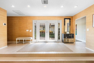 This thoughtfully cared for home offers 3 spacious bedrooms on Atlantis Golf Club in Florida - for sale on GolfHomes.com, golf home, golf lot