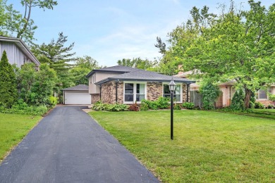 At first glance, this brick and sided split-level home may on Ravisloe Country Club in Illinois - for sale on GolfHomes.com, golf home, golf lot