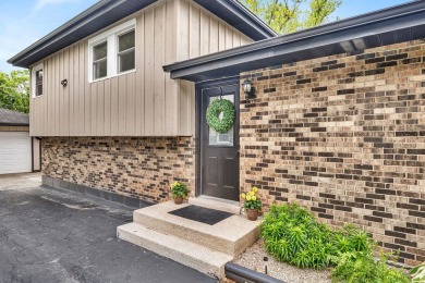 At first glance, this brick and sided split-level home may on Ravisloe Country Club in Illinois - for sale on GolfHomes.com, golf home, golf lot