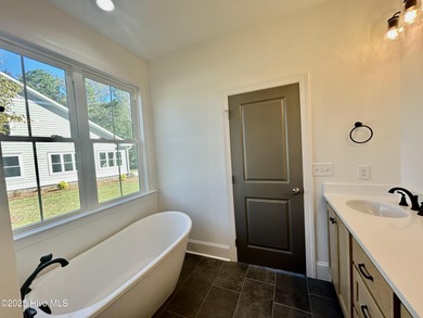 Modern Farmhouse Living Meets Coastal ConvenienceThis modern on River Landing Golf Course in North Carolina - for sale on GolfHomes.com, golf home, golf lot