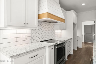 Modern Farmhouse Living Meets Coastal Convenience. A must see on River Landing Golf Course in North Carolina - for sale on GolfHomes.com, golf home, golf lot