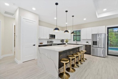 Welcome to your dream Florida oasis! This stunning newly built on Sabal Trace Golf and Country Club in Florida - for sale on GolfHomes.com, golf home, golf lot