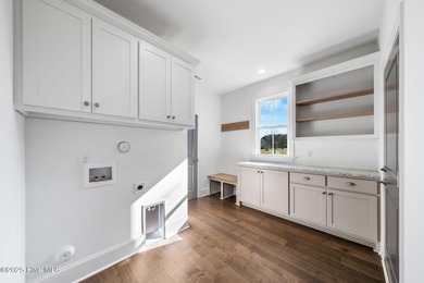 Modern Farmhouse Living Meets Coastal Convenience. A must see on River Landing Golf Course in North Carolina - for sale on GolfHomes.com, golf home, golf lot