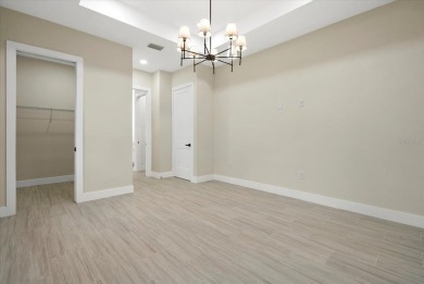 Welcome to your dream Florida oasis! This stunning newly built on Sabal Trace Golf and Country Club in Florida - for sale on GolfHomes.com, golf home, golf lot