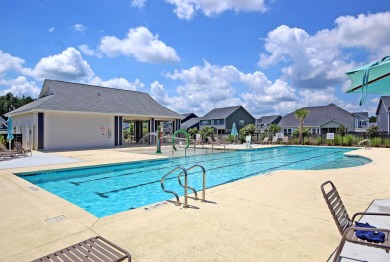 This stunning 5-bedroom, 4.5-bath home in The Oaks at Cane Bay on Cypress Point Par 3 in South Carolina - for sale on GolfHomes.com, golf home, golf lot