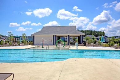 This stunning 5-bedroom, 4.5-bath home in The Oaks at Cane Bay on Cypress Point Par 3 in South Carolina - for sale on GolfHomes.com, golf home, golf lot