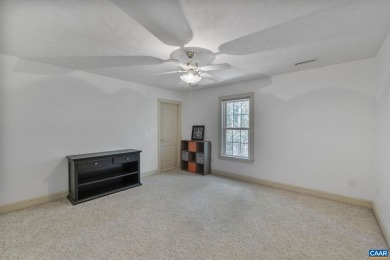 Nestled on a serene half-acre flat lot that backs to peaceful on Lake Monticello Golf Course in Virginia - for sale on GolfHomes.com, golf home, golf lot