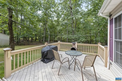 Nestled on a serene half-acre flat lot that backs to peaceful on Lake Monticello Golf Course in Virginia - for sale on GolfHomes.com, golf home, golf lot