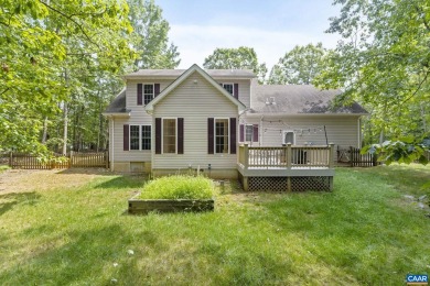 Nestled on a serene half-acre flat lot that backs to peaceful on Lake Monticello Golf Course in Virginia - for sale on GolfHomes.com, golf home, golf lot