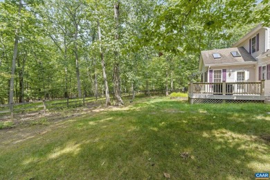 Nestled on a serene half-acre flat lot that backs to peaceful on Lake Monticello Golf Course in Virginia - for sale on GolfHomes.com, golf home, golf lot